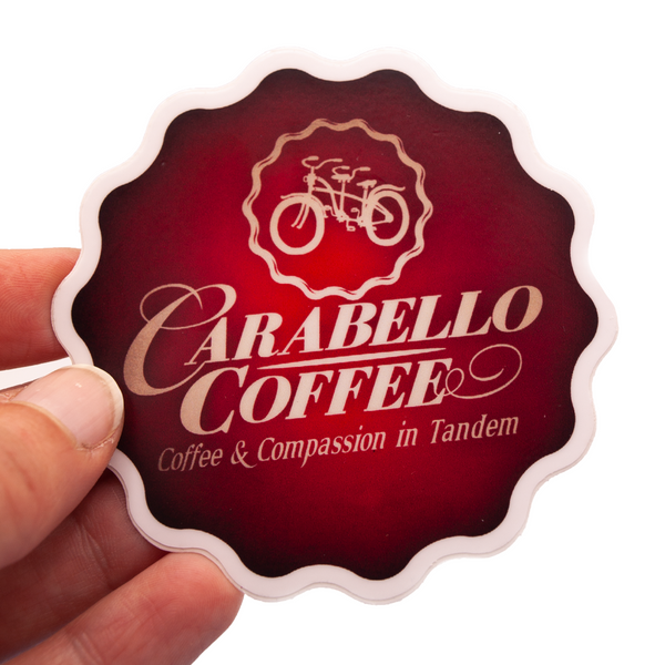 Sticker featuring Carabello Coffee logo in a red bottle cap shape 