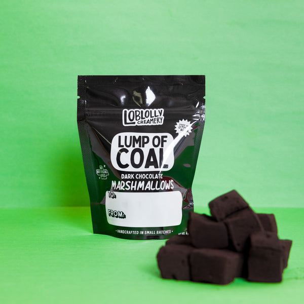 Lump of coal marshmallows with mallows in front of bag