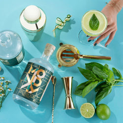 Drink Monday brand non alcoholic gin.  Mint, limes, and bar cocktail supplies 