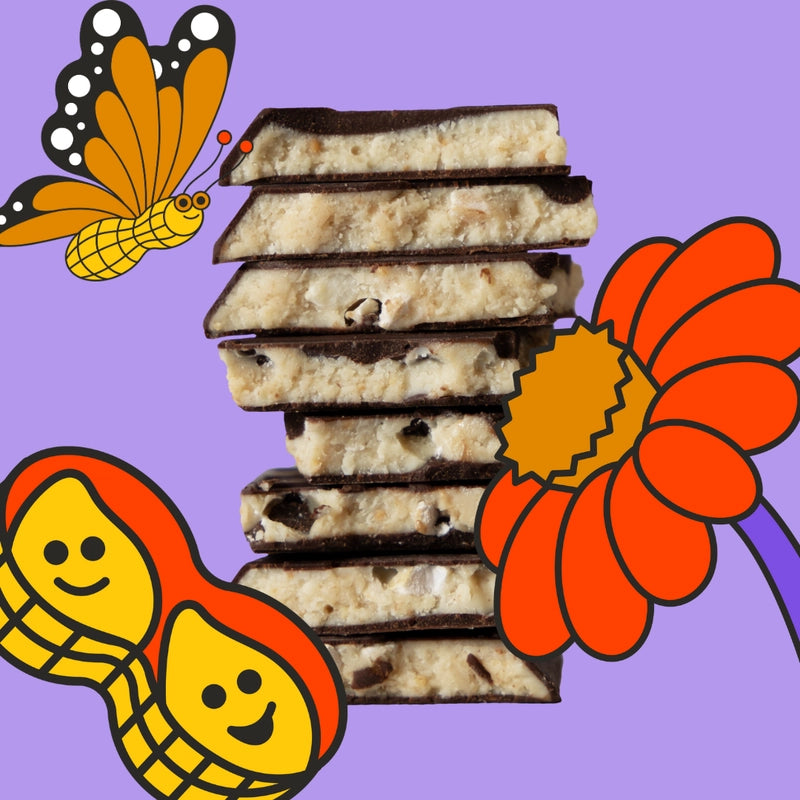 Stack of chocolate-dipped cookies with a butterfly, flower, and cartoon character on a purple background