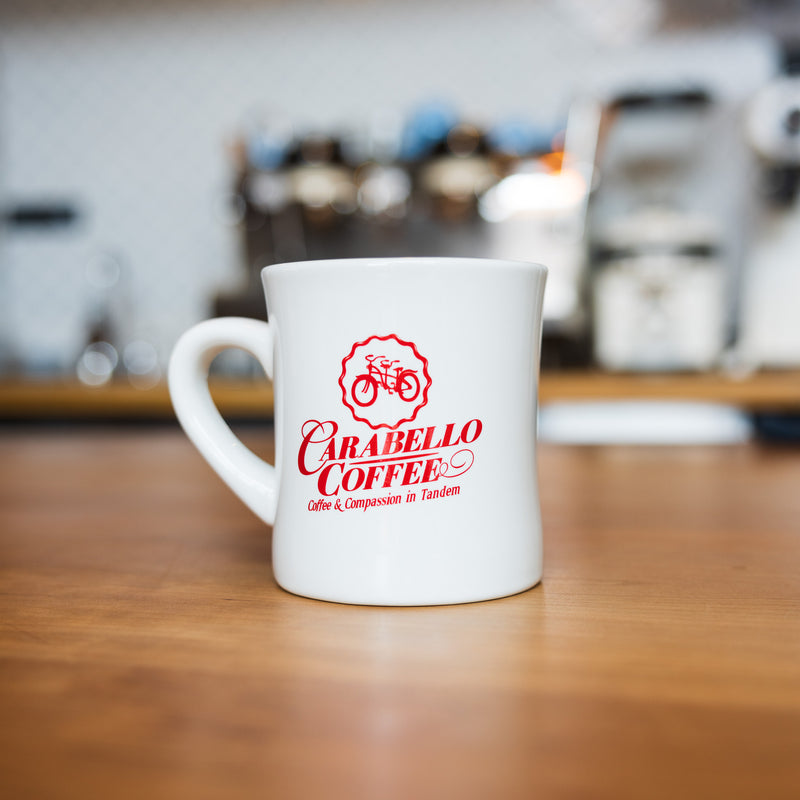 Whine diner mug featuring red Carabello Coffee logo
