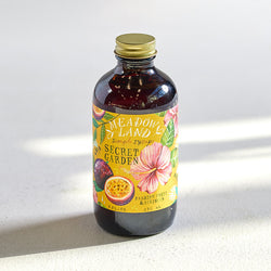 Meadowland Brand Simple Syrup in passion fruit and hibiscus flavor.  8oz bottle used to make mocktails or cocktails or sweeten tea. 